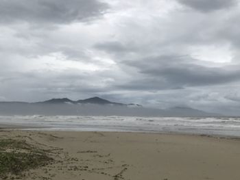 Scenic view of beach against sky