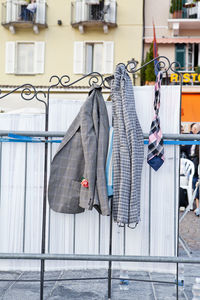 Clothes drying on railing against building