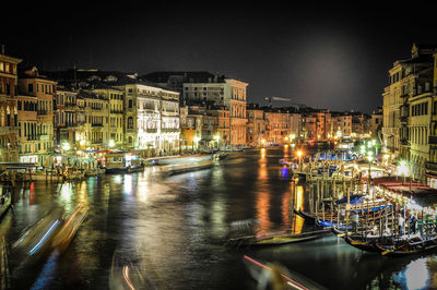 Boats in canal with buildings in background