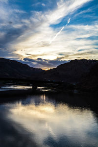Scenic view of lake against sky during sunset