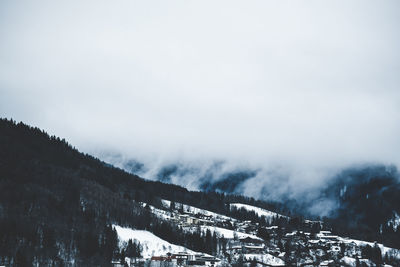 Scenic view of snow covered mountains against sky