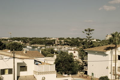 Houses in town against sky
