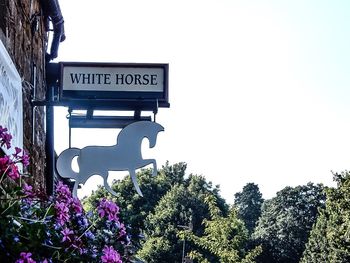 Low angle view of information sign