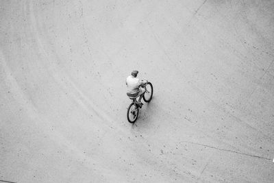 High angle view of person riding bicycle