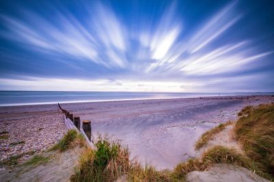 Scenic view of beach against sky