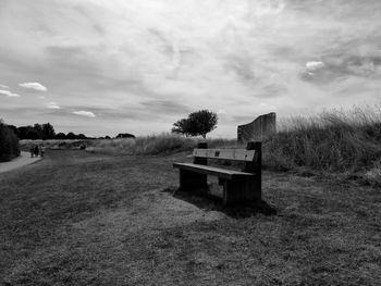 Built structure on field against sky