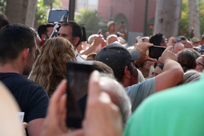 Crowd photographing on street