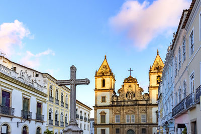 Old houses and churches with a crucifix in the central square of pelourinho district,salvador, bahia