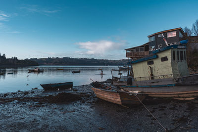 Boats moored in lake