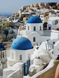 View of white buildings in town