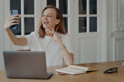 Young businesswoman working at desk in office