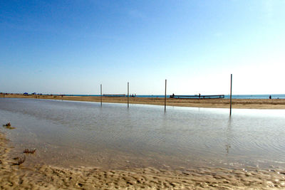 Scenic view of beach against clear sky