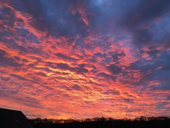 Low angle view of dramatic sky during sunset