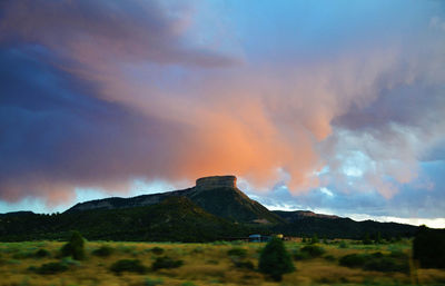 Scenic view of mountains against sky at sunset