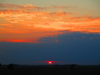 Scenic view of silhouette landscape against sky during sunset