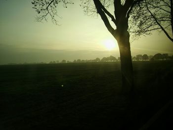 Scenic view of landscape against sky at sunset