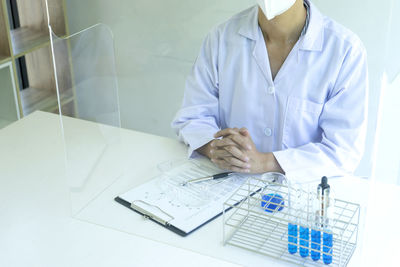 High angle view of man working on table