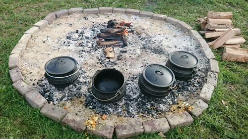 High angle view of utensils by burning chulah