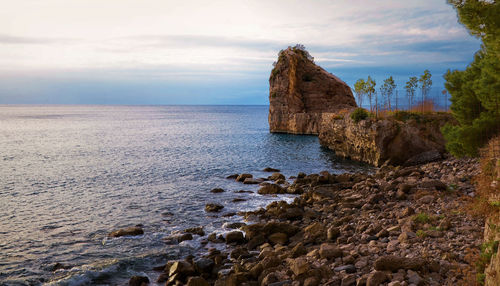 Scenic view of sea against cloudy sky