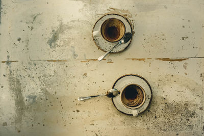 Directly above shot of empty coffee cups on table
