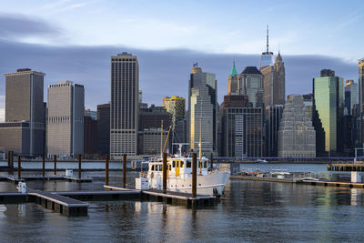 Financial district skyline of downtown new york city shot from pier over east river