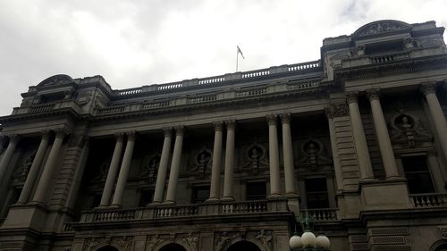 Low angle view of historical building against cloudy sky