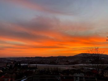 Townscape against sky during sunset