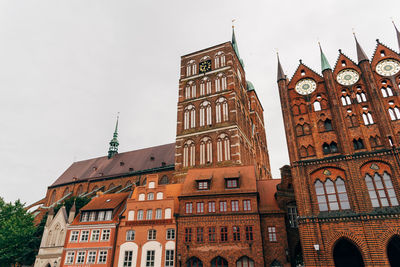 Low angle view of clock tower against sky
