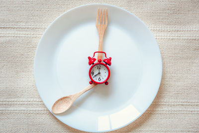 Close-up of clock on table