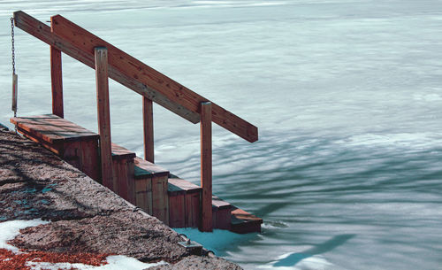 Pier over lake against sky