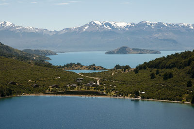 Scenic view of lake and mountains against sky