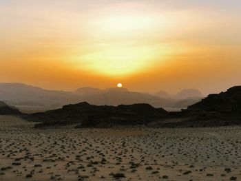 Scenic view of mountains against sky during sunset