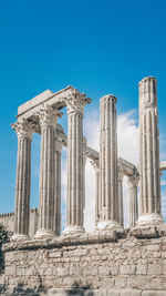 Low angle view of historical building against clear blue sky