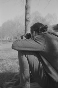 Rear view of man photographing