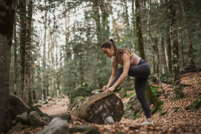 Full length of woman in forest