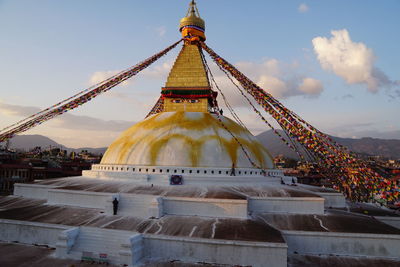 View of temple building against cloudy sky