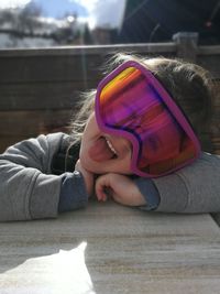 Close-up of girl sitting outdoors