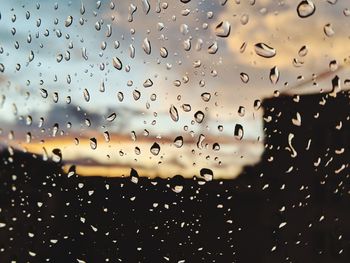 Close-up of raindrops on glass window