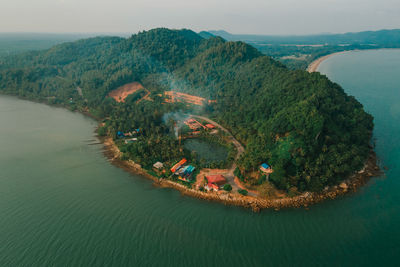 High angle view of bay on shore against sky