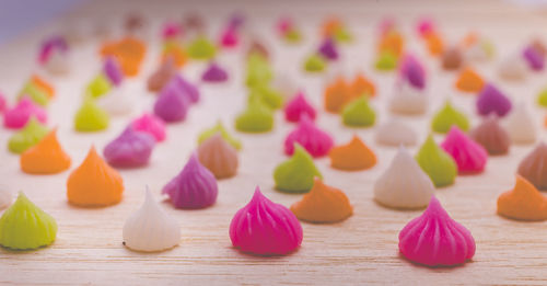 Close-up of multi colored candies on table