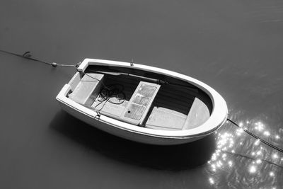 High angle view of boat moored in lake against sky