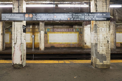 Sign board on columns at railroad station platform