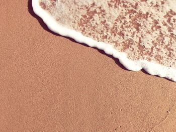 High angle view of sand on beach