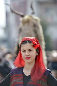 Portrait of young woman standing outdoors