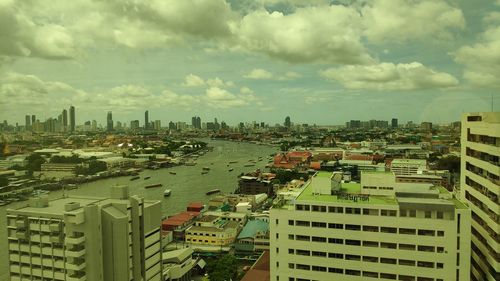 High angle view of buildings in city against sky