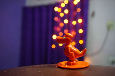 Close-up of illuminated lighting equipment on table