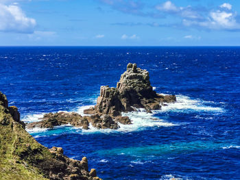 Scenic view of sea against blue sky