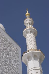 Low angle view of bell tower against sky
