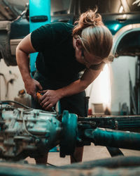 Rear view of woman working