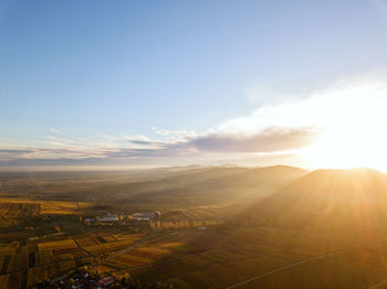 Scenic view of landscape against sky during sunset